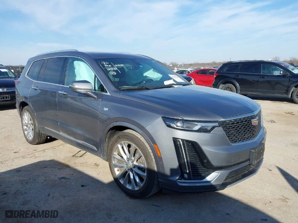 2020 Cadillac XT6 FWD Premium Luxury with VIN 1GYKPCRS8LZ129799, listed as a IAAI auction lot 41602536 with 96,865 mi miles. Bid and sale history available at carsss.com. Image 1.