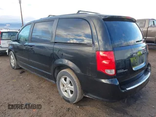 2012 Dodge Grand Caravan SXT with VIN 2C4RDGCG3CR318900, listed as a IAAI auction lot 41145958 with 201,117 mi miles and . Bid and sale history available at DreamBid. Image 3.