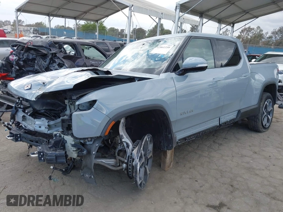 2023 Rivian R1T Adventure z VIN 7FCTGBAA9PN027894, wystawiony jako IAAI lot #42061339 z przebiegiem 5047 mil mil oraz . Historia ofert i sprzedaży dostępna na DreamBid. Obrazek 24.