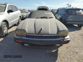 1995 Jaguar XJS with VIN SAJNX2748SC198836, listed as a Copart auction lot 75833334 with 145,794 mi miles and Salvage Title. Bid and sale history available at carsss.com. Image 5.