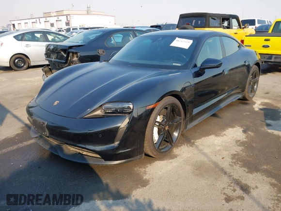 2022 Porsche Taycan z VIN WP0AA2Y10NSA11640, wystawiony jako IAAI lot #41215410 z przebiegiem 25 749 mil mil oraz . Historia ofert i sprzedaży dostępna na DreamBid. Obrazek 2.
