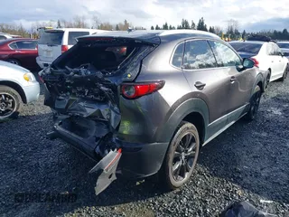2021 Mazda CX-30 Premium with VIN 3MVDMBDY2MM239231, listed as a IAAI auction lot 41655159 with 22,679 mi miles and . Bid and sale history available at carsss.com. Image 4.