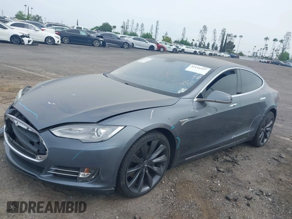 2013 Tesla Model S with VIN 5YJSA1AG5DFP13149, listed as a IAAI auction lot 42116437 with 140,999 mi miles. Bid and sale history available at carsss.com. Image 2.