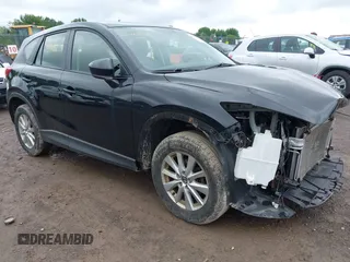 2014 Mazda CX-5 Sport z VIN JM3KE4BE4E0399648, wystawiony jako IAAI lot #42452015 z przebiegiem 105 621 mil mil oraz . Historia ofert i sprzedaży dostępna na DreamBid. Obrazek 1.