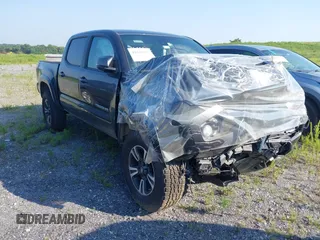 2019 Toyota Tacoma SR with VIN 3TMCZ5AN0KM279881, listed as a IAAI auction lot 41840821 with 95,537 mi miles and . Bid and sale history available at DreamBid. Image 1.