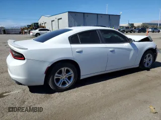 2015 Dodge Charger SE with VIN 2C3CDXBG2FH867283, listed as a Copart auction lot 47313835 with 124,448 mi miles and Salvage Title. Bid and sale history available at carsss.com. Image 3.