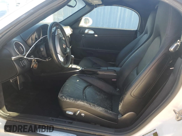2007 Porsche Boxster S z VIN WP0CB29837U730970, wystawiony jako Copart lot #77829184 z przebiegiem Nie podano mil oraz Szkoda całkowita • Salvage title. Historia ofert i sprzedaży dostępna na DreamBid. Obrazek 7.