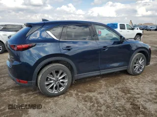 2021 Mazda CX-5 Grand Touring with VIN JM3KFBDM0M0500561, listed as a Copart auction lot 58214665 with 49,543 mi miles and Salvage title. Bid and sale history available at DreamBid. Image 3.