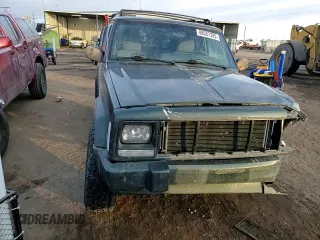 1997 Jeep Cherokee Country with VIN 1J4FJ78SXVL566804, listed as a Copart auction lot 88557395 with 216,230 mi miles and Salvage title. Bid and sale history available at DreamBid. Image 12.