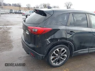 2016 Mazda CX-5 Grand Touring with VIN JM3KE4DY3G0769448, listed as a IAAI auction lot 41947725 with 154,051 mi miles and . Bid and sale history available at carsss.com. Image 18.
