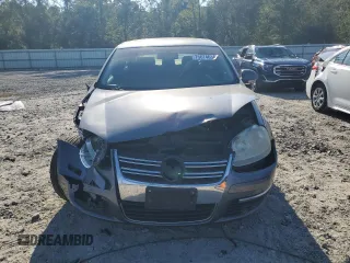 2006 Volkswagen Jetta z VIN 3VWDG71K26M673879, wystawiony jako Copart lot #75674634 z przebiegiem 93 689 mil mil oraz Szkoda całkowita • Salvage title. Historia ofert i sprzedaży dostępna na DreamBid. Obrazek 5.