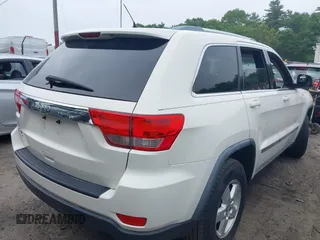 2011 Jeep Grand Cherokee Laredo with VIN 1J4RR4GG0BC670506, listed as a IAAI auction lot 42462778 with 241,406 mi miles and . Bid and sale history available at DreamBid. Image 4.