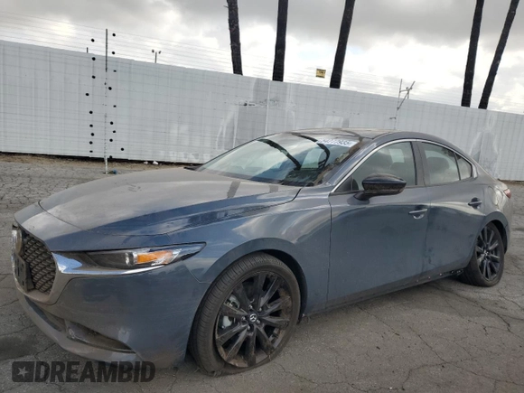 2024 Mazda 3 S Carbon Edition with VIN 3MZBPBCM0RM403689, listed as a Copart auction lot 54277935 with 7,040 mi miles and Salvage Title. Bid and sale history available at DreamBid. Image 1.