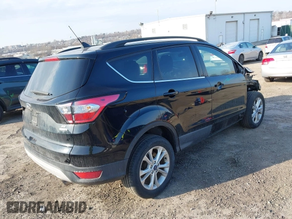 2018 Ford Escape SE z VIN 1FMCU9GD9JUC25456, wystawiony jako IAAI lot #41721436 z przebiegiem 55 642 mil mil oraz . Historia ofert i sprzedaży dostępna na DreamBid. Obrazek 4.