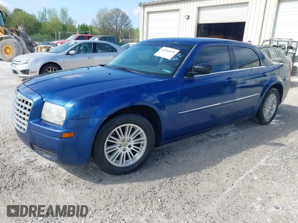 2009 Chrysler 300 LX with VIN 2C3KA43D69H614978, listed as a IAAI auction lot 41966879 with 247,871 mi miles. Bid and sale history available at carsss.com. Image 2.