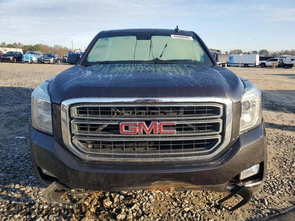 2015 GMC Yukon SLT with VIN 1GKS1BKC0FR735059, listed as a Copart auction lot 42960685 with 242,220 mi miles and Salvage Title. Bid and sale history available at carsss.com. Image 5.