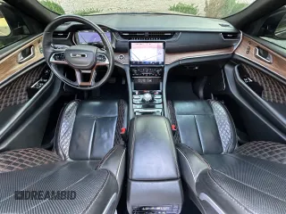 2023 Jeep Grand Cherokee Summit with VIN 1C4RJHEG2P8882566, listed as a Copart auction lot 65095905 with 59,970 mi miles and Salvage title. Bid and sale history available at DreamBid. Image 9.