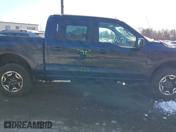 2023 Ford F-150 Lightning Pro with VIN 1FTVW1EL7PWG07081, listed as a IAAI auction lot 38702102 with 9,976 mi miles and . Bid and sale history available at DreamBid. Image 13.
