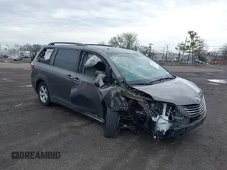 2015 Toyota Sienna LE AAS with VIN 5TDKK3DC1FS615090, listed as a IAAI auction lot 41965112 with 116,745 mi miles. Bid and sale history available at carsss.com. Image 6.
