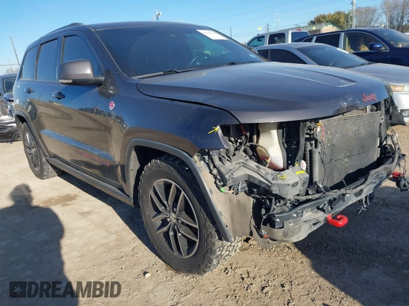 2018 Jeep Grand Cherokee Trailhawk with VIN 1C4RJFLT9JC244212, listed as a IAAI auction lot 41443469 with 77,953 mi miles and . Bid and sale history available at DreamBid. Image 1.