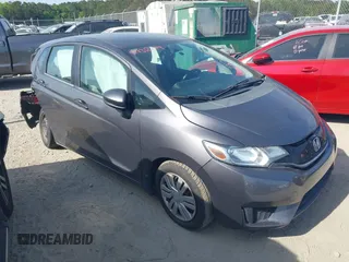 2015 Honda Fit LX z VIN 3HGGK5H52FM771511, wystawiony jako IAAI lot #42132749 z przebiegiem 96 666 mil mil oraz . Historia ofert i sprzedaży dostępna na DreamBid. Obrazek 1.