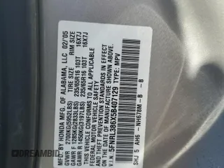 2005 Honda Odyssey EX-L z VIN 5FNRL386X5B407129, wystawiony jako Copart lot #56366655 z przebiegiem 181 893 mil mil oraz Szkoda całkowita • Salvage title. Historia ofert i sprzedaży dostępna na DreamBid. Obrazek 13.