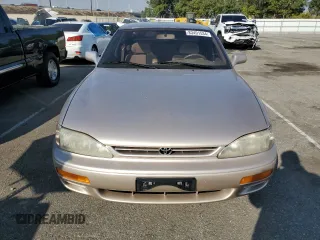 1995 Toyota Camry LE with VIN JT2GK12E7S0107467, listed as a Copart auction lot 83491534 with 112,971 mi miles and Salvage Title. Bid and sale history available at carsss.com. Image 5.