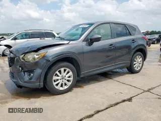 2014 Mazda CX-5 Touring z VIN JM3KE2CY7E0382601, wystawiony jako Copart lot #59492405 z przebiegiem 233 289 mil mil oraz Szkoda całkowita • Salvage title. Historia ofert i sprzedaży dostępna na DreamBid. Obrazek 1.