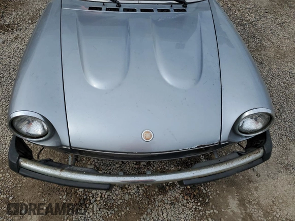1980 FIAT 124 Spider z VIN 124CS000167543, wystawiony jako Copart lot #53031904 z przebiegiem 60 115 mil mil oraz Nie do naprawy • Non repairable. Historia ofert i sprzedaży dostępna na DreamBid. Obrazek 11.