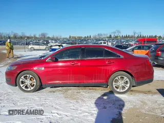 2015 Ford Taurus SEL z VIN 1FAHP2E85FG163421, wystawiony jako IAAI lot #41320489 z przebiegiem 165 618 mil mil oraz . Historia ofert i sprzedaży dostępna na DreamBid. Obrazek 14.