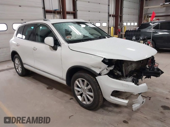 2014 Volkswagen Touareg Sport with VIN WVGEF9BP6ED005007, listed as a IAAI auction lot 41757033 with Not Provided miles and . Bid and sale history available at DreamBid. Image 1.