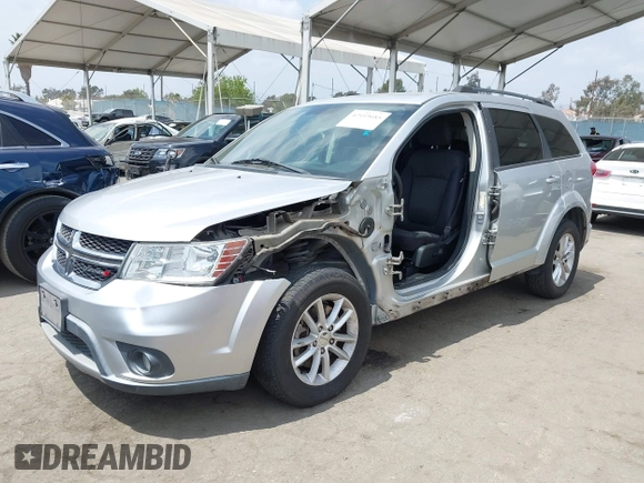 2013 Dodge Journey SXT with VIN 3C4PDCBG9DT506384, listed as a IAAI auction lot 42119685 with 143,769 mi miles. Bid and sale history available at carsss.com. Image 2.
