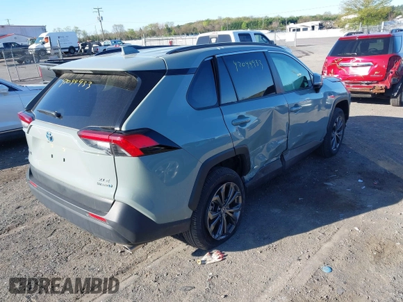 2023 Toyota RAV4 Hybrid XLE Premium with VIN JTMB6RFV3PD116696, listed as a IAAI auction lot 42044933 with 18,553 mi miles. Bid and sale history available at carsss.com. Image 4.