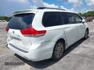 2014 Toyota Sienna XLE with VIN 5TDYK3DC4ES414728, listed as a IAAI auction lot 42588916 with 291,007 mi miles and . Bid and sale history available at DreamBid. Image 4.