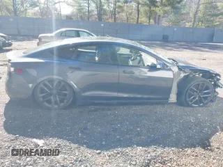 2021 Tesla Model S Long Range with VIN 5YJSA1E52MF428370, listed as a IAAI auction lot 41809773 with 34,372 mi miles and . Bid and sale history available at DreamBid. Image 13.