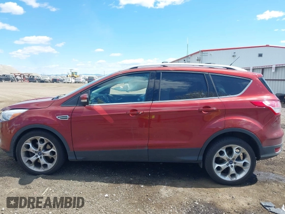 2014 Ford Escape Titanium with VIN 1FMCU9J91EUB53601, listed as a IAAI auction lot 42066465 with 105,933 mi miles and . Bid and sale history available at DreamBid. Image 14.