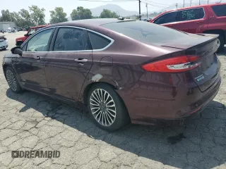 2017 Ford Fusion Titanium z VIN 3FA6P0SU8HR313773, wystawiony jako Copart lot #58791695 z przebiegiem 141 777 mil mil oraz Czysty tytuł • Clean title. Historia ofert i sprzedaży dostępna na DreamBid. Obrazek 2.