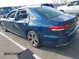 2021 Volkswagen Passat SE with VIN 1VWSA7A36MC010749, listed as a IAAI auction lot 42141065 with 43,571 mi miles and . Bid and sale history available at DreamBid. Image 3.