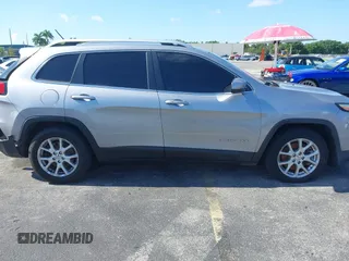 2014 Jeep Cherokee Latitude with VIN 1C4PJLCS6EW103423, listed as a IAAI auction lot 40118289 with 112,120 mi miles and . Bid and sale history available at DreamBid. Image 21.