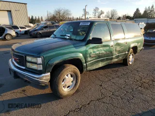 1997 GMC Suburban with VIN 3GKFK16RXVG513571, listed as a Copart auction lot 82086924 with 190,142 mi miles and Salvage Title. Bid and sale history available at DreamBid. Image 1.