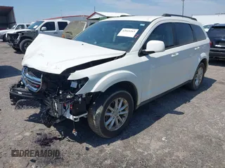 2013 Dodge Journey SXT with VIN 3C4PDCBG0DT701712, listed as a IAAI auction lot 42015263 with 92,533 mi miles. Bid and sale history available at carsss.com. Image 2.