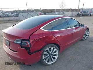 2019 Tesla Model 3 Mid Range with VIN 5YJ3E1EA3KF466418, listed as a IAAI auction lot 41724564 with 53,774 mi miles and . Bid and sale history available at DreamBid. Image 4.
