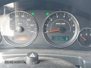 2007 Jeep Commander Sport with VIN 1J8HG48K27C661932, listed as a IAAI auction lot 42132895 with 255,707 mi miles. Bid and sale history available at carsss.com. Image 7.