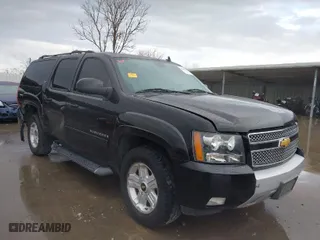 2013 Chevrolet Suburban LT with VIN 1GNSKJE71DR308480, listed as a IAAI auction lot 41695090 with 129,000 mi miles. Bid and sale history available at carsss.com. Image 1.