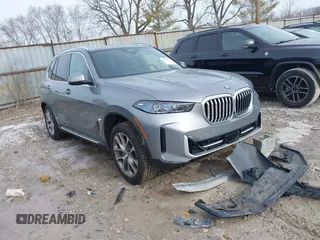2025 BMW X5 xDrive40i with VIN 5UX23EU02S9X44610, listed as a IAAI auction lot 41469794 with 1,964 mi miles. Bid and sale history available at carsss.com. Image 1.