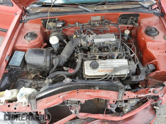 1989 Plymouth Colt GT z VIN JP3CU34X7KU085019, wystawiony jako Copart lot #61891764 z przebiegiem 188 465 mil mil oraz Czysty tytuł • Clean title. Historia ofert i sprzedaży dostępna na DreamBid. Obrazek 13.