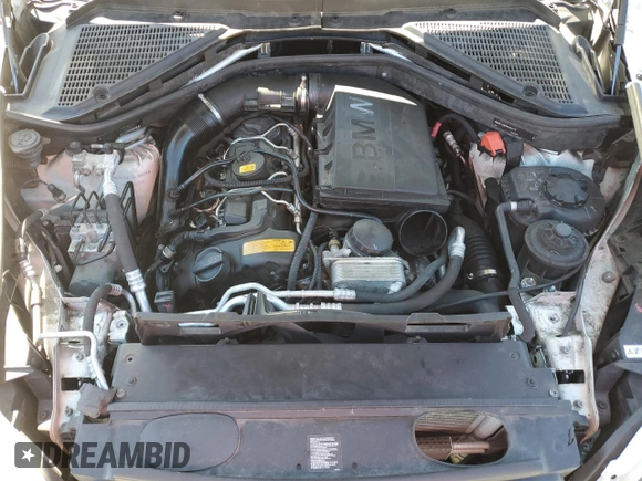 2012 BMW X5 35i with VIN 5UXZV4C5XCL987618, listed as a Copart auction lot 60308965 with 98,195 mi miles and Salvage title. Bid and sale history available at DreamBid. Image 12.
