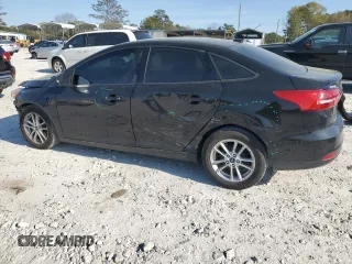 2017 Ford Focus SE with VIN 1FADP3F26HL331253, listed as a Copart auction lot 50869865 with 60,776 mi miles and Salvage title. Bid and sale history available at DreamBid. Image 2.