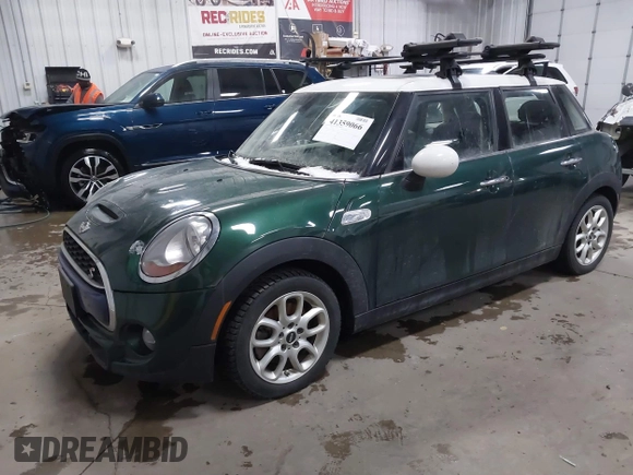 2015 MINI Hardtop 4 Door S z VIN WMWXU3C55FT892293, wystawiony jako IAAI lot #41359066 z przebiegiem 112 704 mil mil oraz . Historia ofert i sprzedaży dostępna na DreamBid. Obrazek 17.