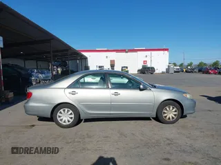 2005 Toyota Camry LE z VIN 4T1BE30K65U543152, wystawiony jako IAAI lot #42183864 z przebiegiem 228 285 mil mil oraz . Historia ofert i sprzedaży dostępna na DreamBid. Obrazek 13.